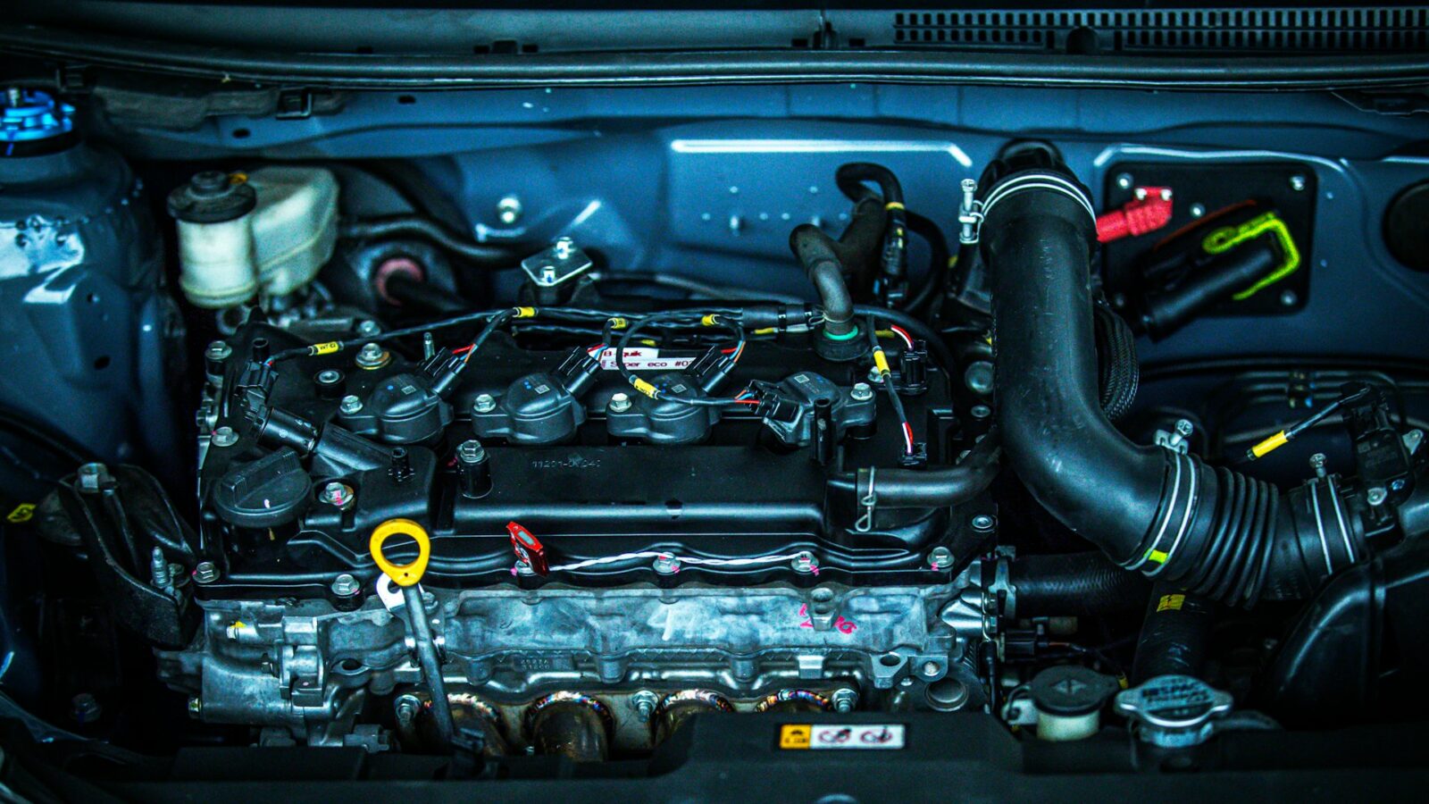 Close-up of a modern engine bay with intake and wiring
