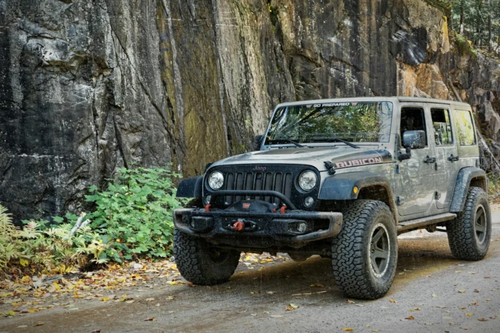 Jeep Wrangler Unlimited Rubicon on a rocky forest road